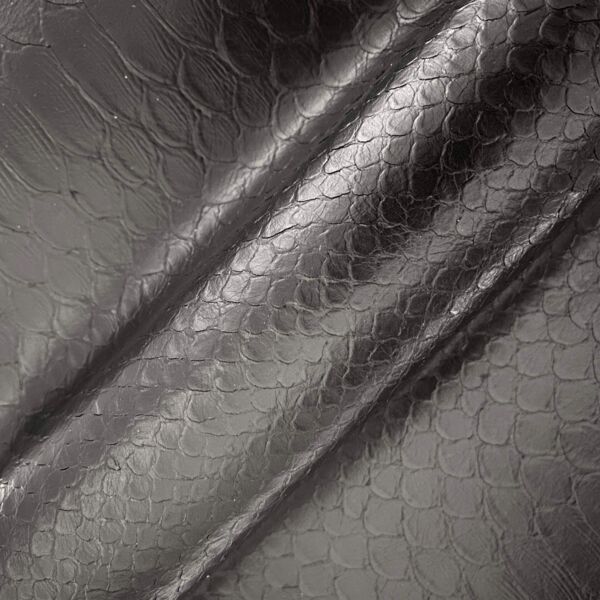 Soft, hand-cut python-embossed half calfskin leather.