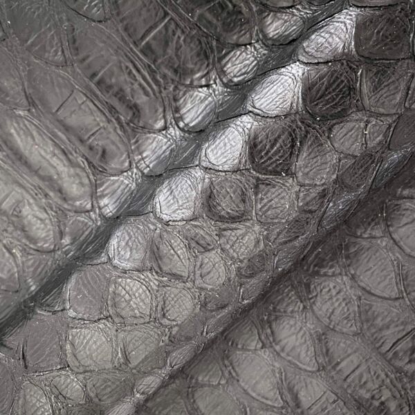 Soft, hand-cut giant python embossed half calfskin leather.